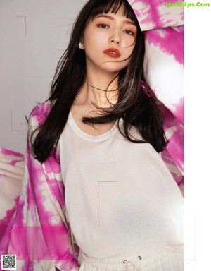 A magazine with a picture of a woman on the cover.