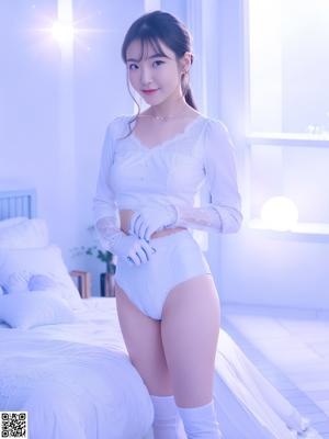 A woman in a black lingerie posing for a picture.