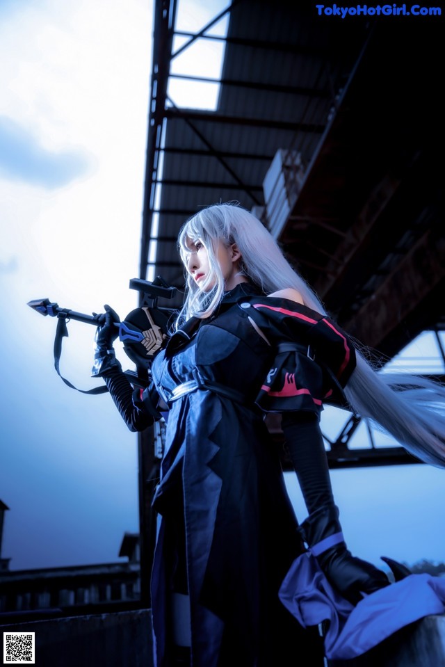 A woman with long white hair holding a sword.